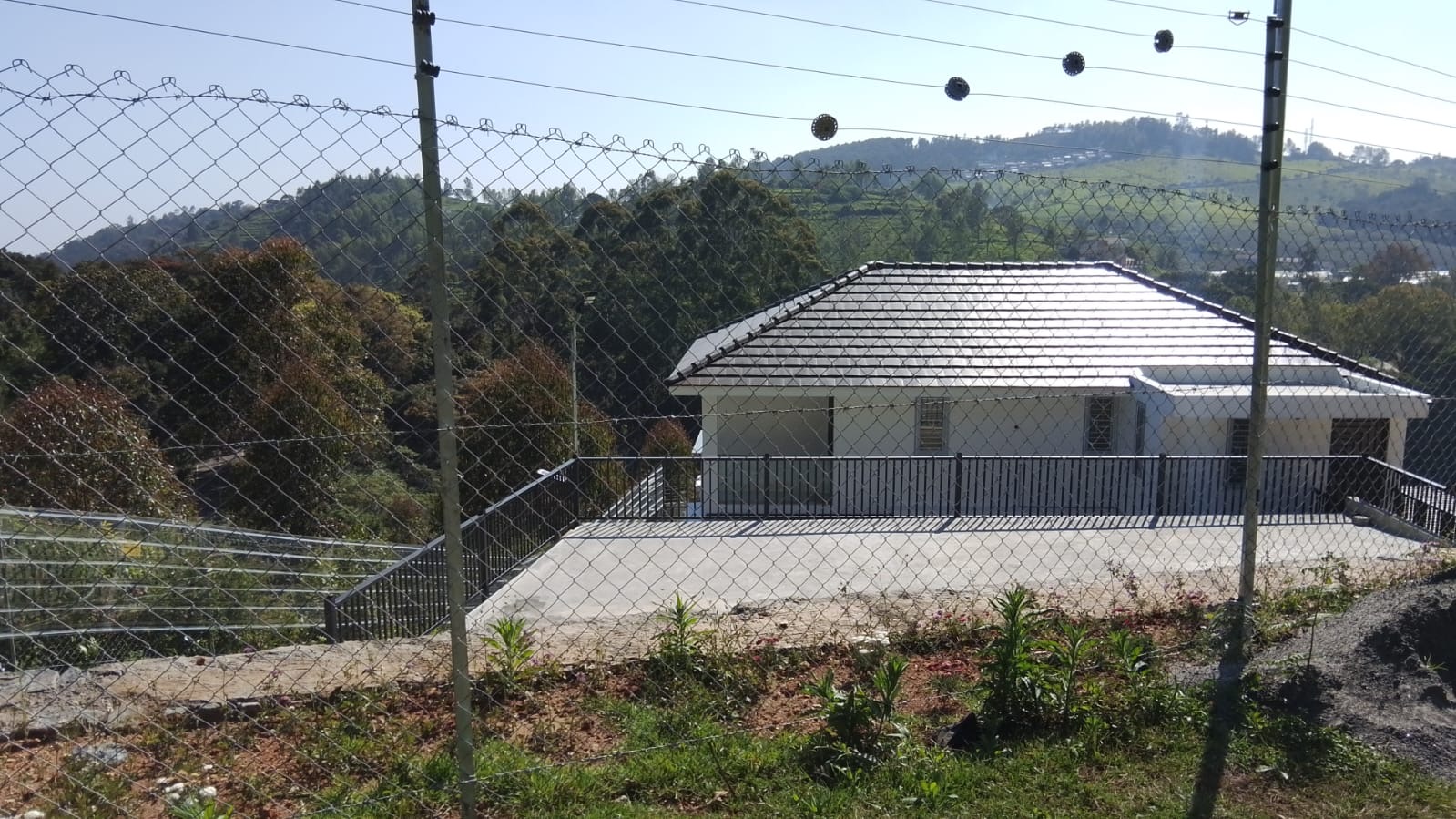 Villa rooftop view through security perimeter